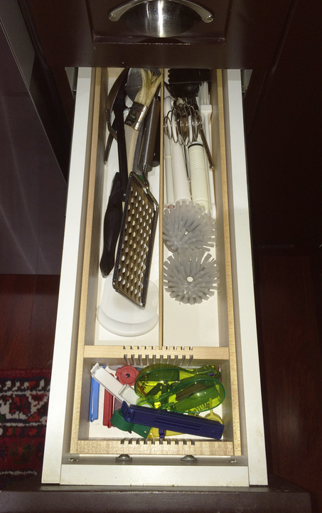 narrow drawer organizer in white kitchen